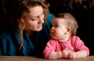 woman staring back at baby