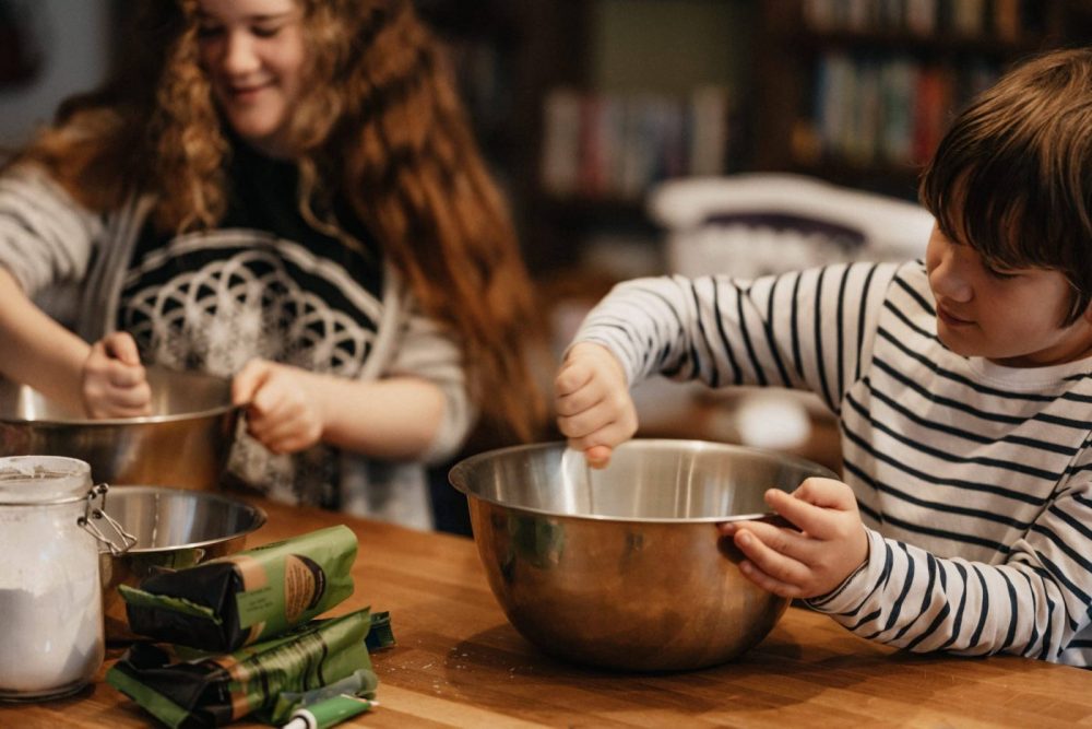 Boy and Girl whisking in bowls
