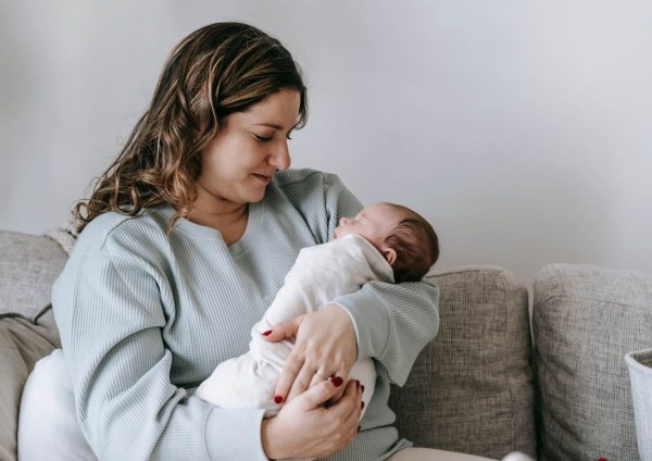 woman cradling baby