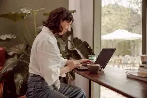 woman searching the internet on a laptop